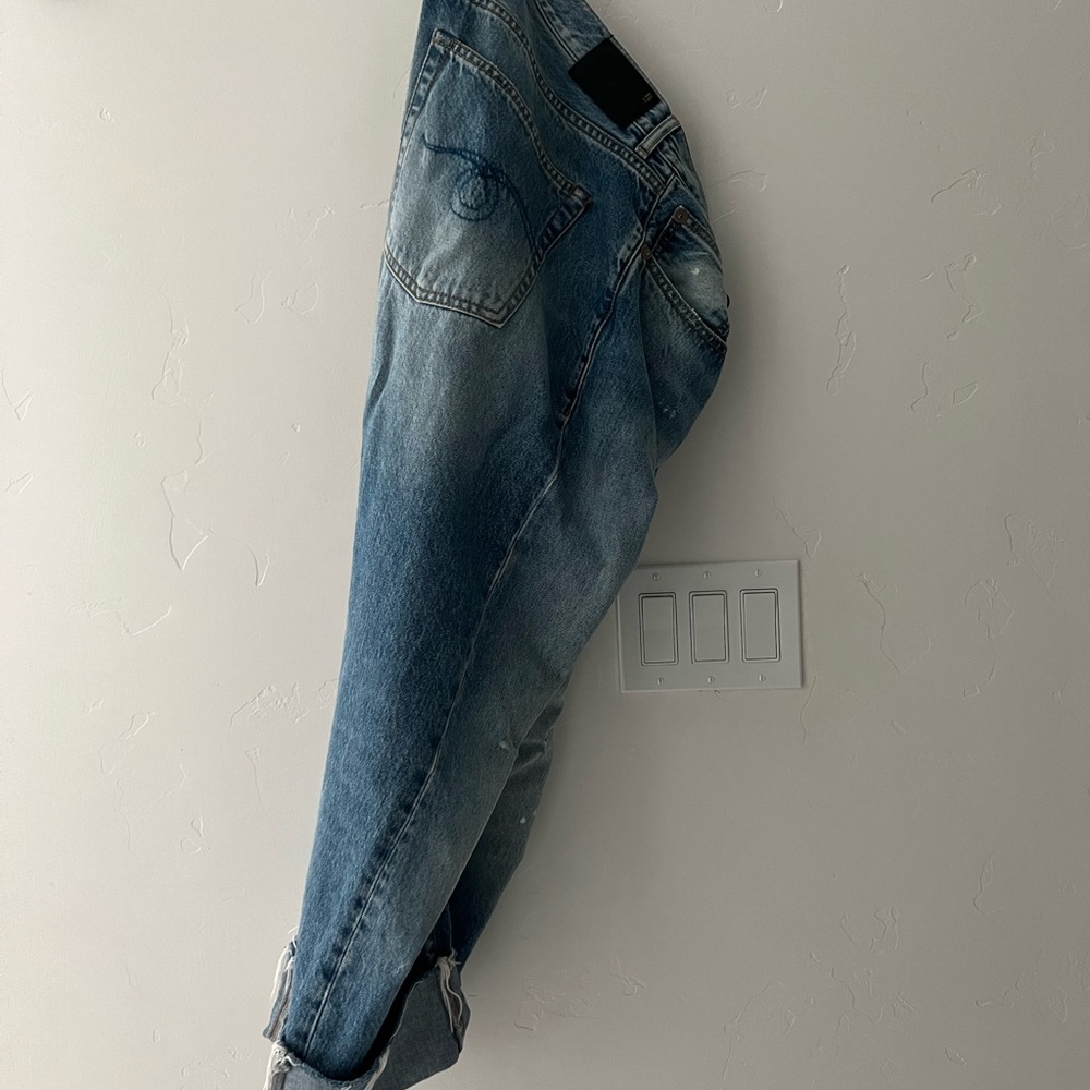 R13 drop crotch cuffed asymmetrical button jeans